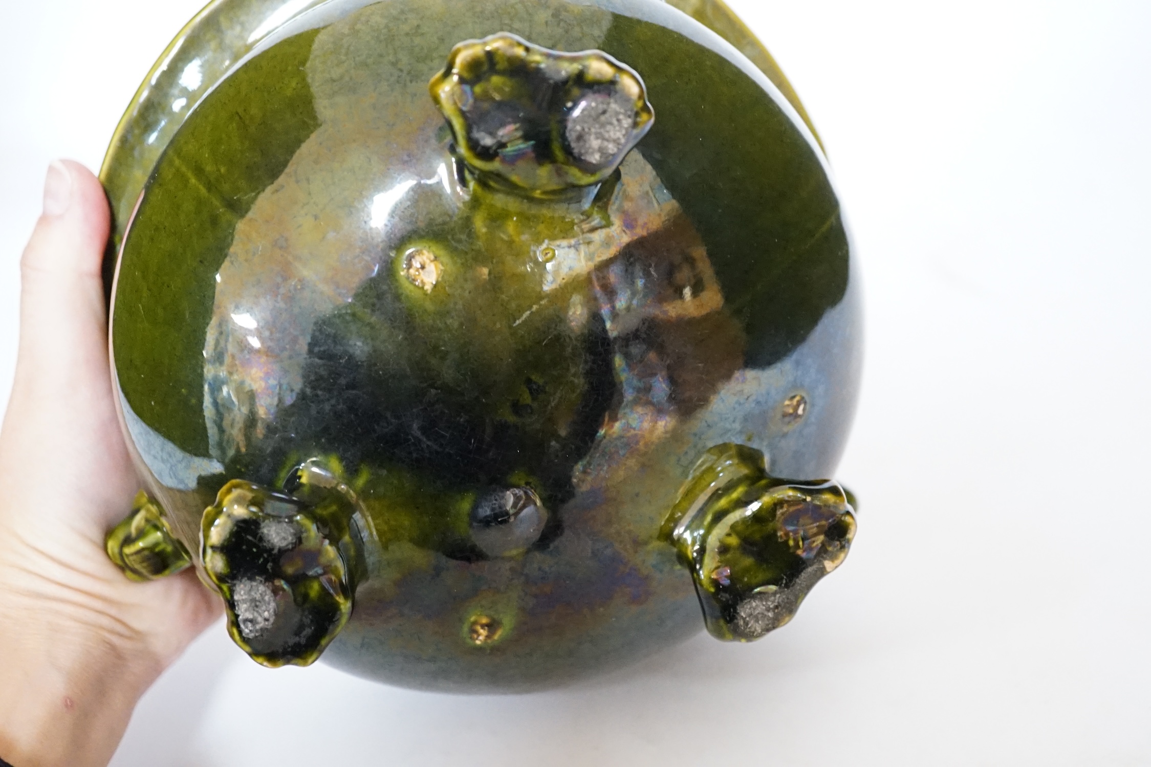 A green glazed Art pottery planter raised on three paw feet, diameter 20.5cm. Condition - good